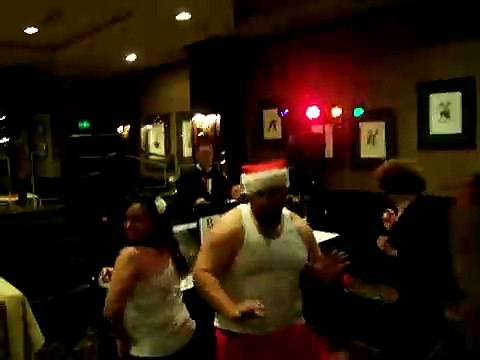 drunk santa pub crawl dancing in wife beater
