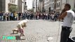 Elderly woman dances in front of beatboxer, big crowd in Brussels - TomoNews