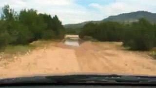 Driving car through water on Ibiza