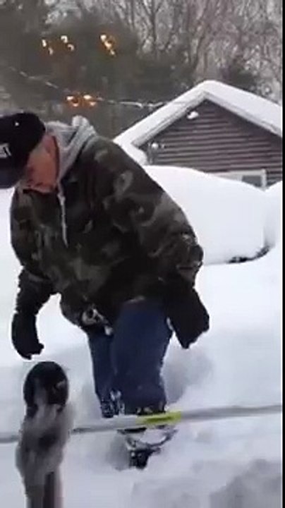 Wife films husband shoveling snow