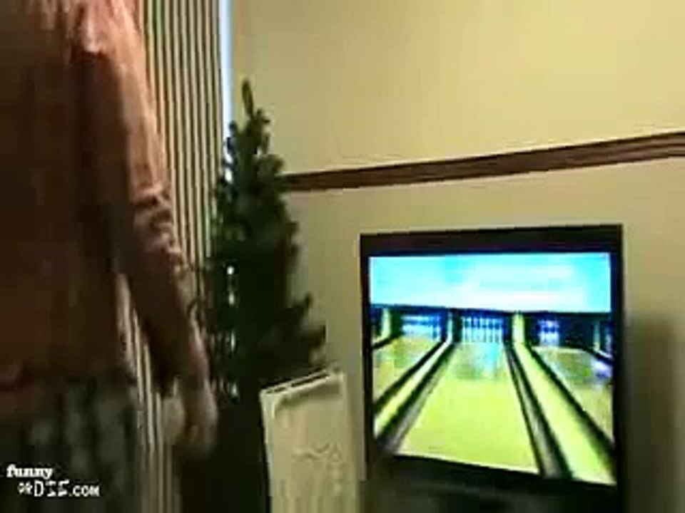 guy breaks tv with wii