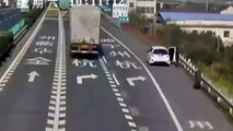 CCTV Woman hit by runaway TIRE after parking car on hard shoulder in China  funny videos