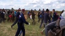 Hungarian camerawoman fired after intentionally kicking, tripping refugees