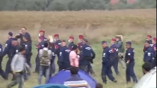 A Hungarian camerawoman was fired after being caught on camera tripping refugees running from the police.