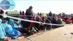 Exhausted refugees camp in open fields in Hungary – video Wo
