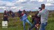 Hungarian camerawoman fired after intentionally kicking, tripping refugees