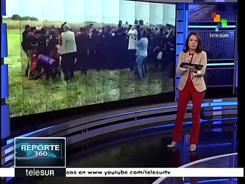 Hungría: recorre el mundo imagen de reportera que golpea refugiados