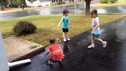 Playing in the rain after getting soaked during our walk