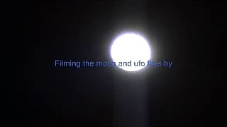 UFO flies by moon