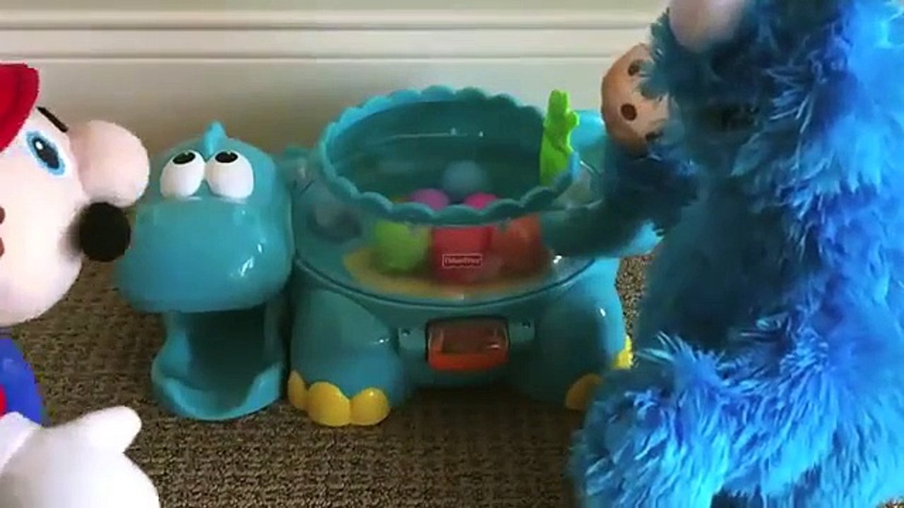 Mario vs Cookie Monster Poppity Pop Musical Dino Ball Popper Dinosaur made by Fisher-Price