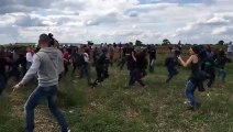 Hungarian Camerawoman Kicking And Tripping Fleeing Refugees Video Out