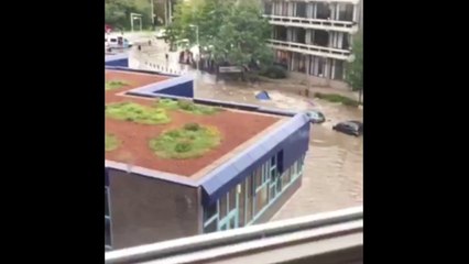 Car swept along by Amsterdam flooding