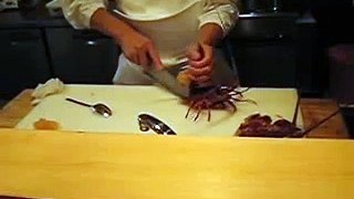 Chef cuts live lobster in half