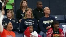 Touching moment basketball player from opposite team hands ball to disabled playe