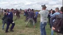 ‎Hungarian‬ camerawoman filming police chase of refugees trips refugee