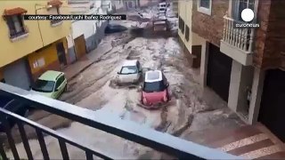 Breaking News - Epic flood drags cars and vans down Spain street