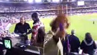 crazy woman at the footy
