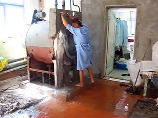 Conventional Laundry in Russia. Unloading of linen