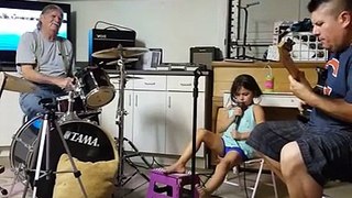 'Shooting rock stars' little girl garage band
