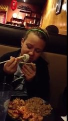 Kenzie eating sushi for the first time.