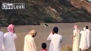 Vehicle with Arabs on top of it Drifting in Flood