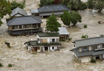 More Japanese rivers overflow bringing further floods, 23 missing