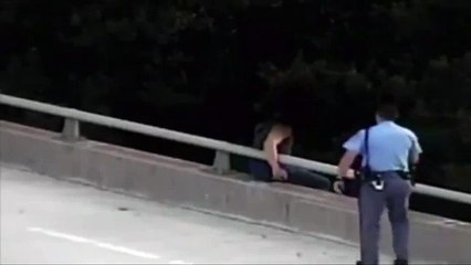 Cop saved a man jumping off; gave him a hug!