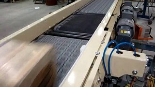 Omni Metalcraft Corp. Activated Roller Belt Conveyor with Retractable Bump Turn
