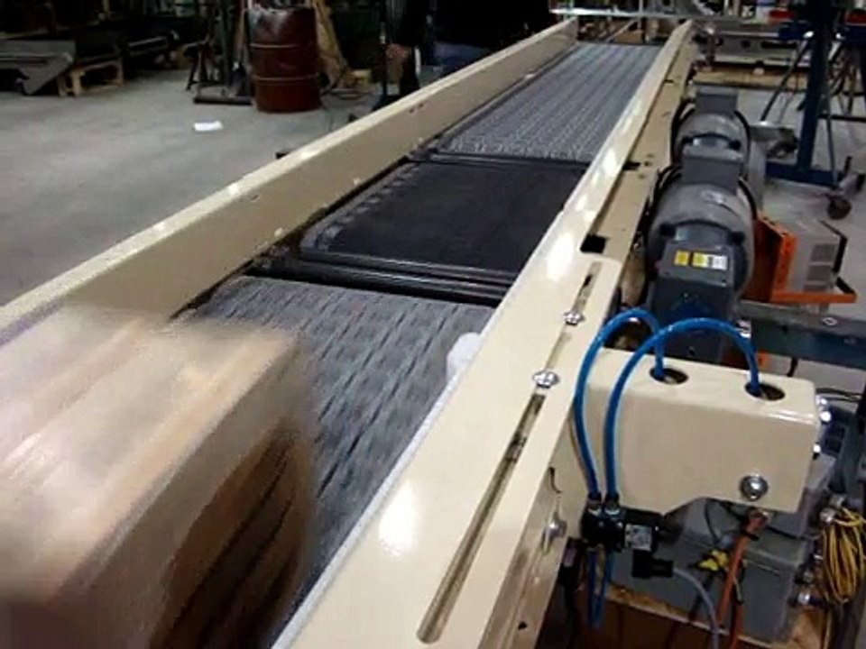 Omni Metalcraft Corp. Activated Roller Belt Conveyor with Retractable Bump Turn