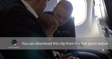 Child and young parents traveling by plane
