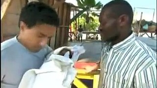 Sanjay Gupta treating 15-day old baby after earthquake in Haiti.mpg