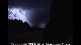 Deadly tornado illuminated by lightning