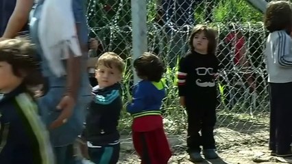 Refugees break through newly-built border fence in Hungary
