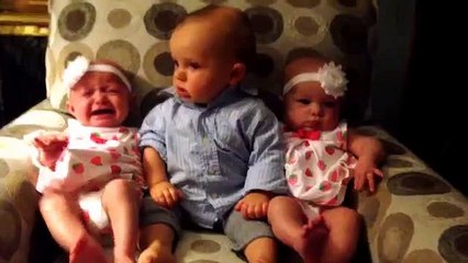 Adorably confused baby meets twins