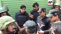 Gunmen attack police in Pakistan, take hostages