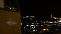 busking with night view of Budapest, Hungary
