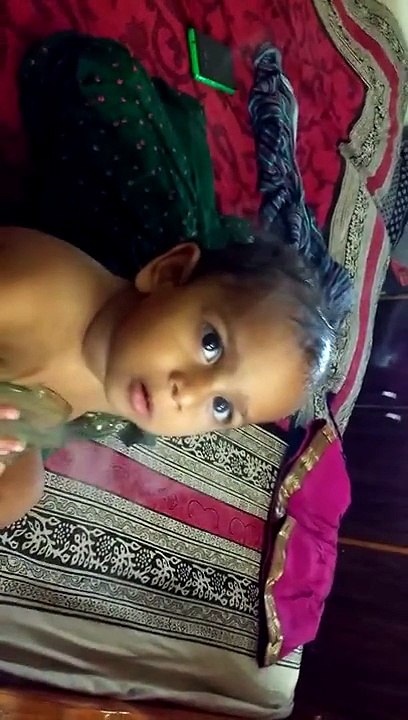 One year old baby, nebulizing herself