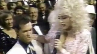 Dolly Parton sneaks up on Randy Travis