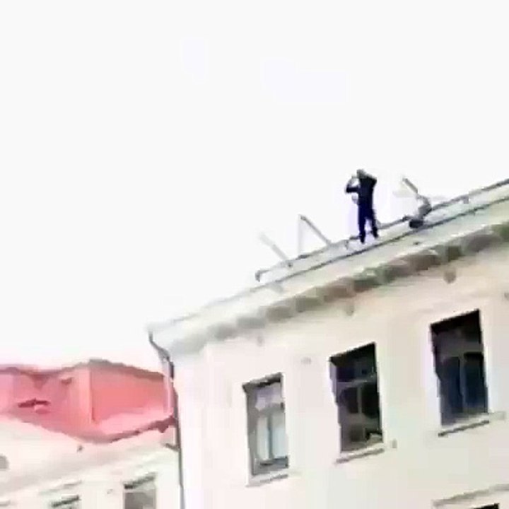 Man Jumps off a building Oh my god must see