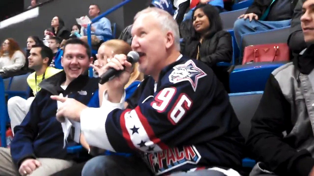 Guy cops a feel on hockey kiss cam