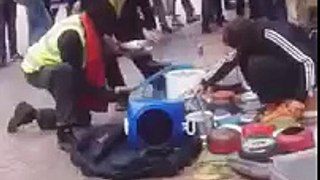 Homeless man playing tins