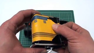 Loading a 120mm film into a Hasselblad