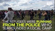 This woman was caught on camera kicking and tripping refugees