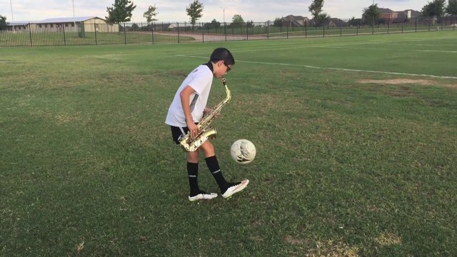 11yo kid plays saxophone while juggling a soccer ball!! careless whisper