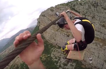 Two base jumpers on a rusty cable ride of death