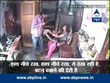 SHOCKING CCTV footage shows man robbing house keeping woman hostage
