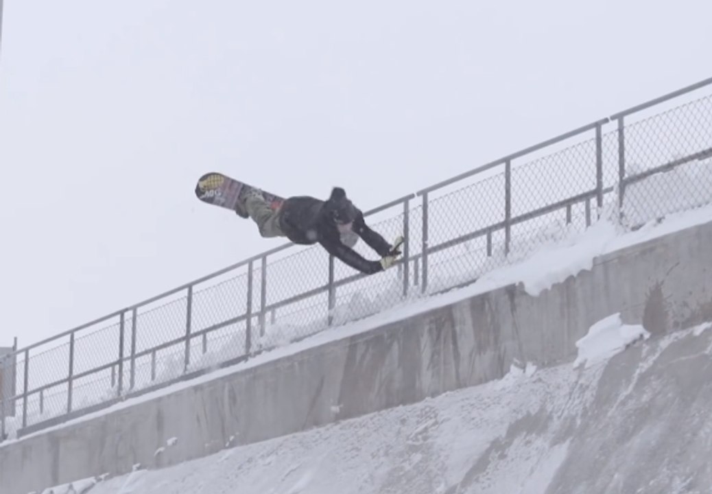 A snowboarder slams hard !