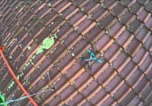 Rescuing a Drone Stuck on a Roof