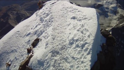 Walking on the Knife Edge of a snow mountain near the summit of Matterhorn