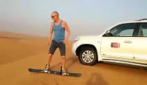 Mr. Kevin Doing Sand Boarding - Desert Safari Tours